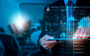 man in a suit standing behind a hologram of data analytics